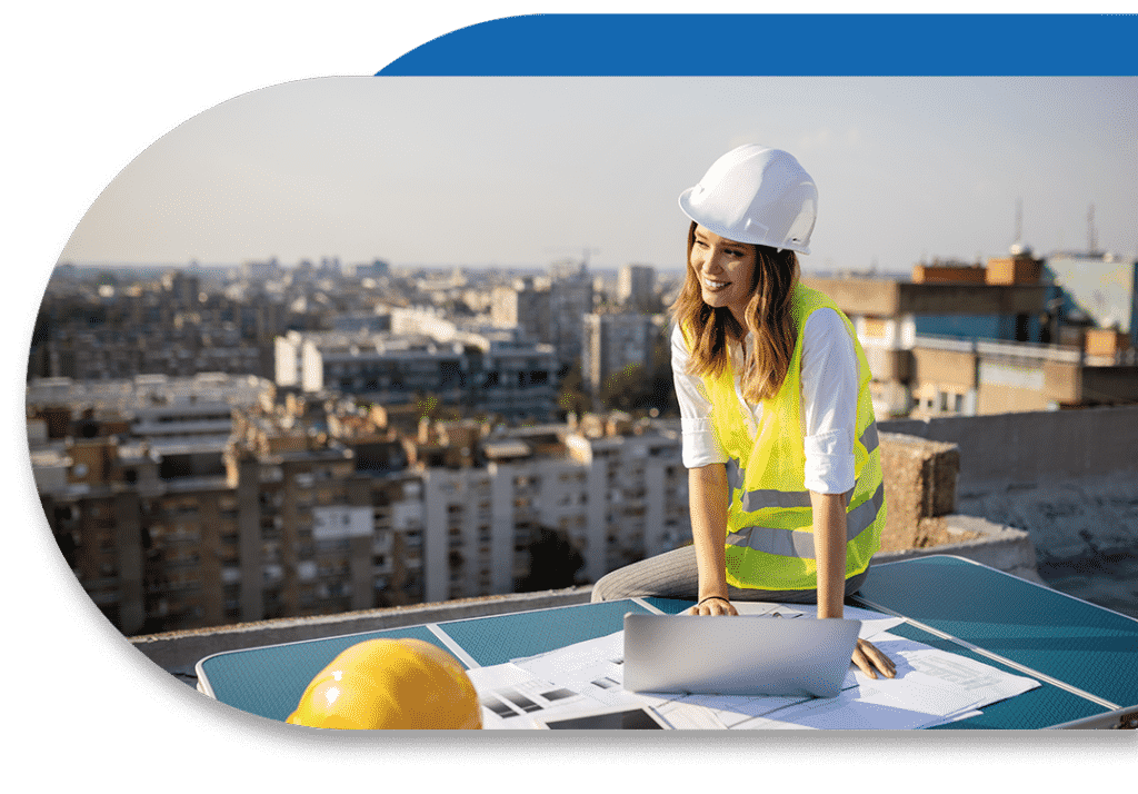 female construction worker on top of building - IT services for construction